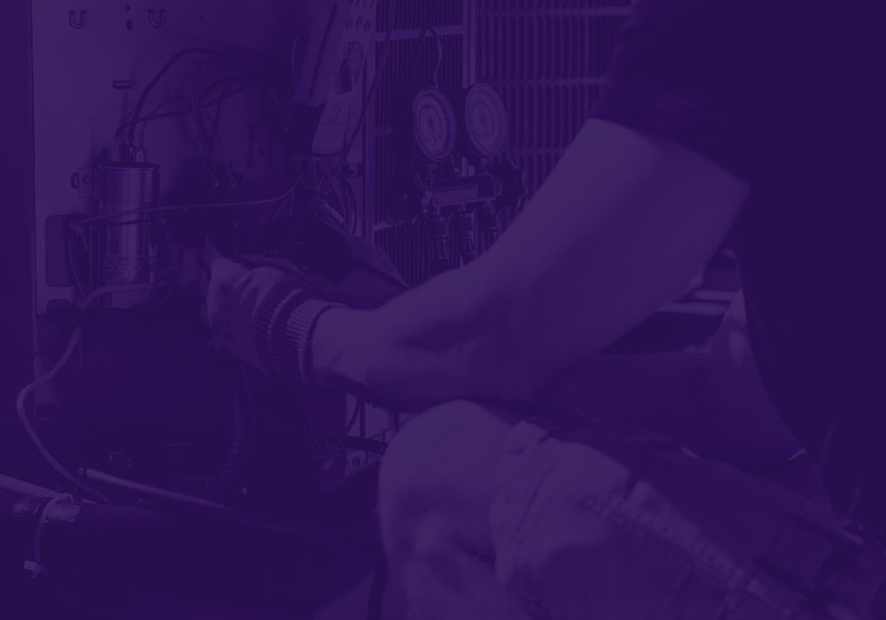 Technician repairing HVAC system, adjusting components for efficient performance.