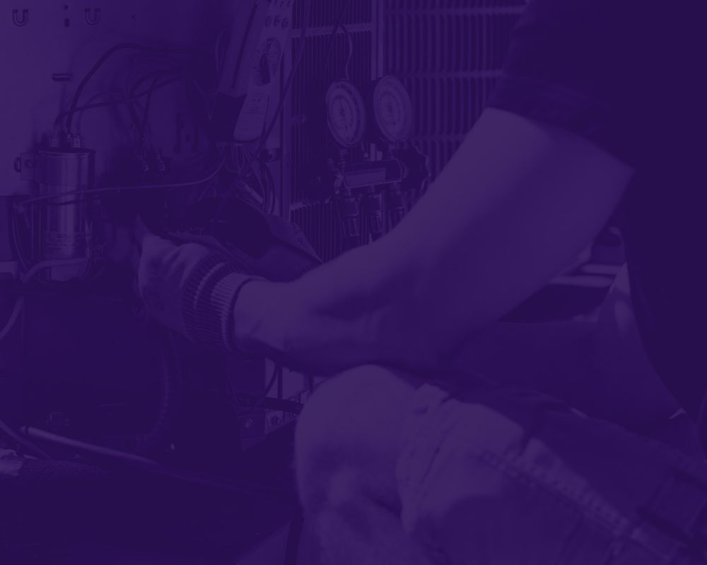 Technician repairing HVAC system, adjusting components for efficient performance.
